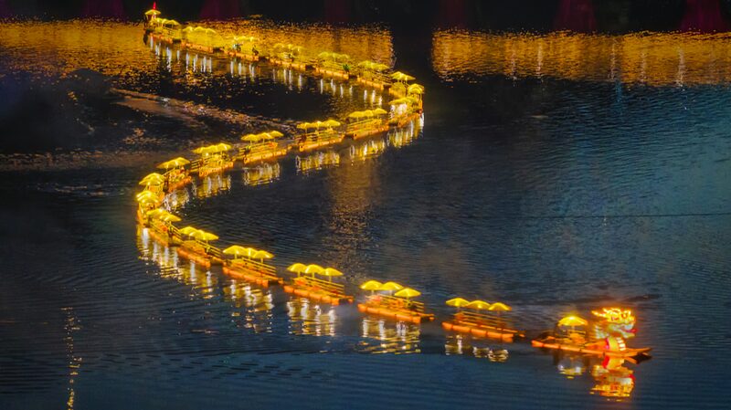 Bamboo_Raft_Dragon_Illuminates_Huangshan_River__