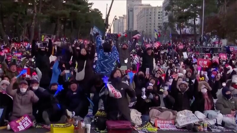 Cheers_in_the_Streets__South_Korea_s_Parliament_Impeaches_President_Yoon_Suk_yeol___poster - News for amigos, by amigos Cheers_in_the_Streets__South_Korea_s_Parliament_Impeaches_President_Yoon_Suk_yeol__ video poster