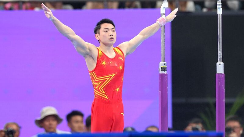 China_s_Zou_Jingyuan_Ready_to_Defend_Parallel_Bars_Crown_at_Paris_Olympics__poster - News for amigos, by amigos __China_s_Zou_Jingyuan_Ready_to_Defend_Parallel_Bars_Crown_at_Paris_Olympics_ video poster