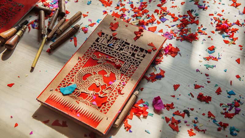 Guomenjian__The_Vibrant_Paper_Cutting_Art_Bringing_Luck_to_Spring_Festival__ - News for amigos, by amigos Guomenjian__The_Vibrant_Paper_Cutting_Art_Bringing_Luck_to_Spring_Festival__