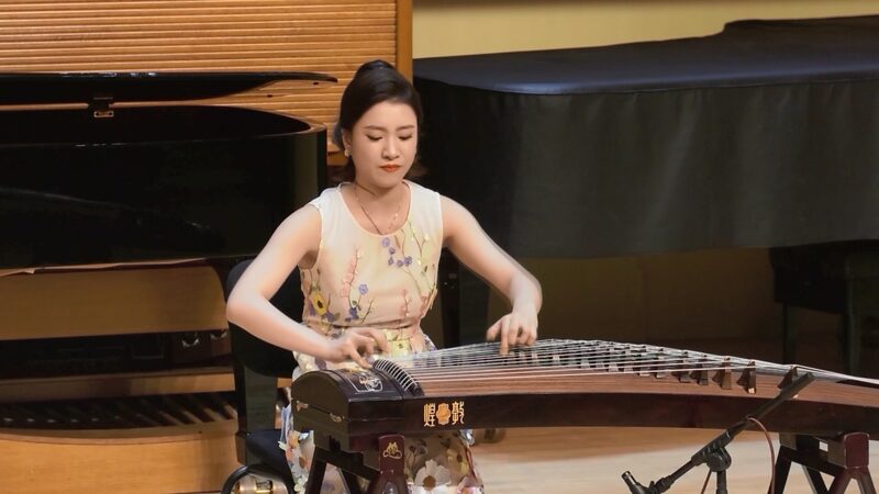 Peggy_Chan_Bridges_Cultures_with_Guzheng_on_Macao_s_25th_Anniversary_poster - News for amigos, by amigos Peggy_Chan_Bridges_Cultures_with_Guzheng_on_Macao_s_25th_Anniversary video poster