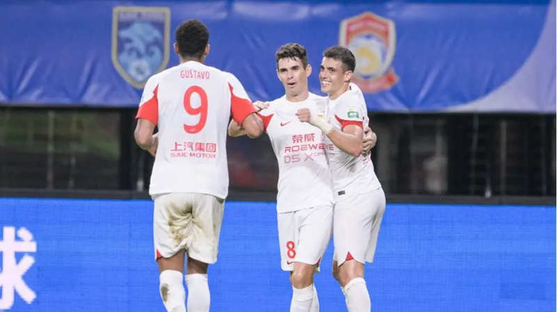 Shanghai_Port_Triumphs_Over_Meizhou_Hakka_2_1_in_Thrilling_CSL_Match___ - News for amigos, by amigos Shanghai_Port_Triumphs_Over_Meizhou_Hakka_2_1_in_Thrilling_CSL_Match___