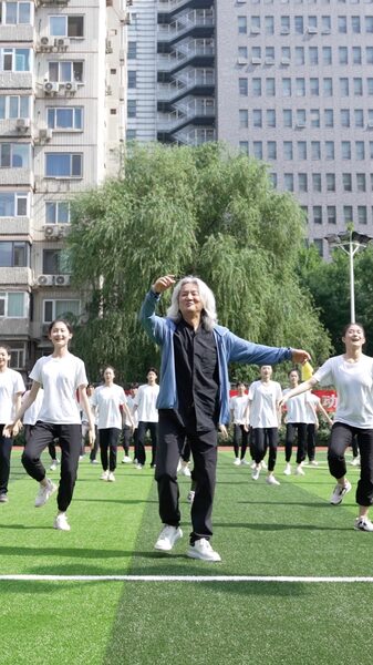 Silver_Haired_Dance_Professor_Rocks_the_Stage_with_Vibrant_Moves_poster - News for amigos, by amigos Silver_Haired_Dance_Professor_Rocks_the_Stage_with_Vibrant_Moves video poster