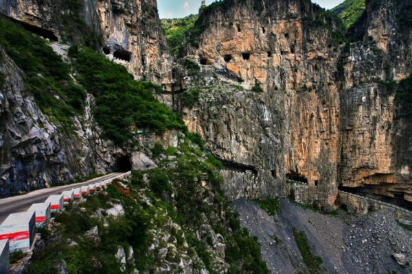 Taihang Mountain’s Miracle: Villagers Carve Cliffside Tunnel to the World 🌄🚧 Taihang_Mountain_s_Miracle__Villagers_Carve_Cliffside_Tunnel_to_the_World___