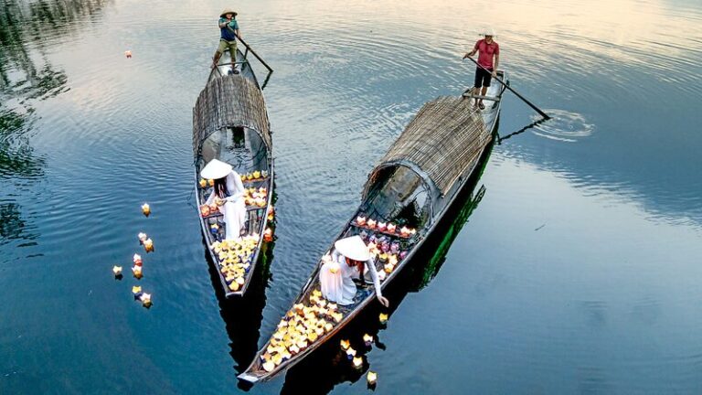 Vietnamese Women Light Up Nhu Y River with Flower Lanterns for Good Fortune Vietnamese_Women_Light_Up_Nhu_Y_River_with_Flower_Lanterns_for_Good_Fortune