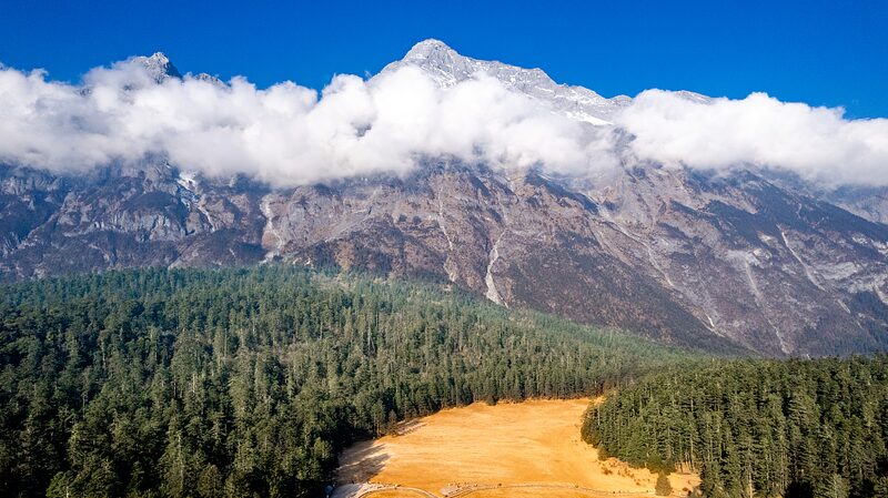 Yulong_Snow_Mountain__China_s_Silver_Dragon_in_Yunnan_s_Spruce_Forest video poster