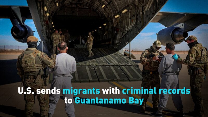 US_Sends_Migrants_with_Criminal_Records_to_Guantanamo_Bay_poster - News for amigos, by amigos US_Sends_Migrants_with_Criminal_Records_to_Guantanamo_Bay video poster