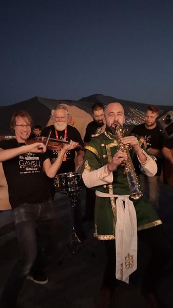 Global_Flash_Mob_Unites_Cultures_at_Mingsha_Mountain_poster - News for amigos, by amigos Global_Flash_Mob_Unites_Cultures_at_Mingsha_Mountain video poster