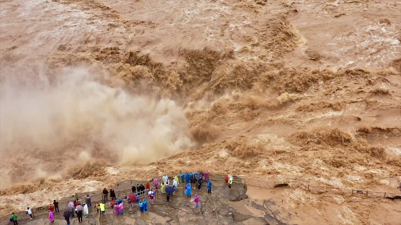 Hukou_Waterfall_Roars_as_Yellow_River_Unleashes_Golden_Cascade video poster